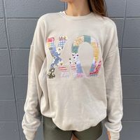 Our super soft drop shoulder Bella crewneck is the perfect addition to your wardrobe. A nod to the patchwork fabric trend with this applique fabric. Our Vintage Coast patchwork fabric is embroidered onto the crew with a simple beaded outline for a sweet vintage look.  Color pairs perfectly with our "Vintage Greek Lette