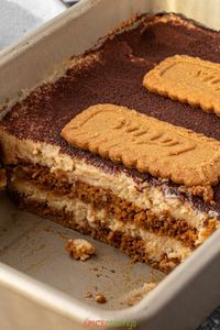 Biscoff Tiramisu is a warm-spiced twist on a classic Italian tiramisu recipe, layered with coffee-soaked Biscoff cookies and rich cookie-butter flavored mascarpone cream. #tiramisu #biscoff