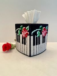 This handmade piano tissue box cover will be a perfect gift for a pianist, organist, keyboard player or music lover!  All four sides are identical with a keyboard and rose. Top has rosebuds in the corners. Fits standard boutique size box of tissues.