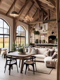 Step into a converted barn that seamlessly blends rustic charm and contemporary elegance. Marvel at the unique and inviting living space that exudes character and style. Experience the perfect fusion of old-world charm and modern comfort in this stunning interior design.