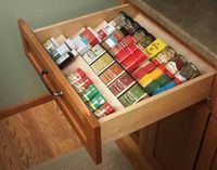 Organize spices with angled shelving:  If your spices are jammed into a drawer with only the tops visible, this nifty rack that slips neatly into the drawer will solve the problem. And it only takes an hour to build. Make it with scraps of 1/4-in. and 1/2-in. plywood.