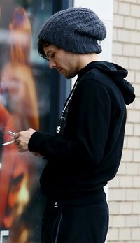 this is so hot its unhealthy i mean sweater, track pants, a beanie the cigarete and its just louis