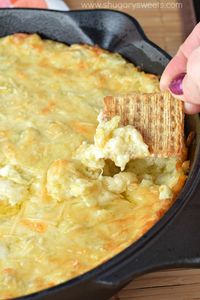 Creamy, warm Artichoke Dip made with garlic, lemon, mozzarella cheese and loads of artichokes! This dip goes fast, so be sure to scoop yourself some before it's gone!