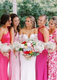 This garden party wedding at the Wildflower 301 was featured on Ruffled Blog. The bride wore white while her bridesmaids wore mismatched pink dresses. Bold pink bridesmaids dress inspo, long bridesmaids dresses! Planned by Always and Forever Events and captured by Sarah Blaze Photography, every moment in this wedding is painted in the vibrant shades of nature’s most captivating palette in bright pink and leafy greens at the beautiful The Wildflower 301 . Seen in Ruffled.