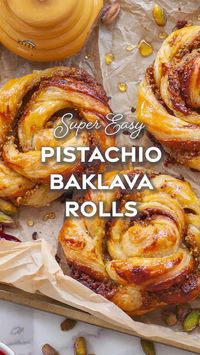 1hr · 12 servings     Ingredients you'll need:   • 2 sheets French puff pastry, (I like the Dufour brand)  • 3/4 cup shelled pistachios, salted & roasted  • 1/4 cup sugar  • 1/4 tsp ground cinnamon  • 1/3 cup unsalted butter, extra soft but not melted  • 2 tbsp honey  • 1/4 cup raspberry jam, optional  • 1 large egg, for egg wash  For Honey Syrup:  • 1/4 cup water  • 1/4 cup honey  • 1 tbsp fresh lemon juice