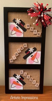 Repurposed wood frame with a hand painted snowman on a burlap base. Assorted ribbon and tinsel accents, dimensional snowflakes, twisted rusty wire mouths and “WARM WINTER KISSES” scrabble tiles. Measures 9”W x 19”H.