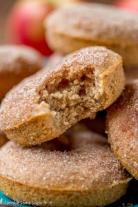 Fluffy spiced donuts spiked with apple cider and rolled in cinnamon spice sugar. They're baked rather than fried and you won't miss it!