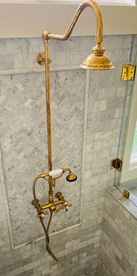 Featuring solid brass construction our exposed shower system is incredible.  A perfect polish gives way to the perfect patina.  Unlacquered to age gracefully with time.   PREORDER FOR LATE AUGUST SHIP DATE  A NOTE ON FINISH The tub faucet is made of 100% solid unlacquered brass with the exception of the hose.  While preferred, it's simply impossible to construct a flexible hose from brass.   CARE AND CLEANING Unlacquered brass is a lovely material that will naturally darken and age with use and exposure. Most of our customers never touch a knob or pull. Whatever you decide, do not use harsh chemicals or bleach. We always recommend a mild dish detergent and water for routine care. If the desire is to bring our polished finish back to its original condition a brass polish can be used, but pl