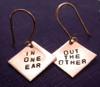 Tiny drop earrings made from hand-cut squares of solid copper, stamped by hand with 'in one ear' and 'out the other'.  Fun, carefree little earrings measuring about 1/2" across. *PLEASE NOTE* I have new earring hooks and the holes are a tad smaller than previous versions. As such, the tops of the squares will be flattened as to fit through the ear wire. The rest of the earring will still have the points. Please note that some people have a sensitivity to copper, and can experience a greenish dis