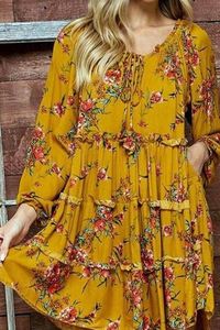 "You'll think of this Dress as a stylish fill in for your favorite comfy Dress/ Long Tunic, that's how useful it is; you'll wear this with EVERYTHING!..like jeans, capri, skirts, leggings ....etc Hand or Machine Wash Long sleeve ; Floral printed baby doll dress/Long tunic with tassel tie-up. 65% Cotton 35% Polyester Length: 36/37" #boho#dress #fashionboho