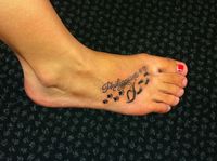 my new tattoo! in the middle is the eating disorder symbol. the paw prints symbolize the struggle that i went throught during it, and the foot prints on the other side represent recover. the bible verse philippians 4:13 is my favorite bible verse and it means "i can do all things through christ who gives me strength" ♥