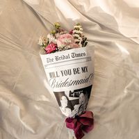 Surprise your bridesmaids with a proposal they won't forget! Propose to your bridesmaids with our bridesmaid newspaper template, a creative and personalized way to ask your closest friends and family members to join your special day. Perfect for adding to a bridesmaid proposal gift box or using as a flower bouquet wrap. ❤ 𝐖𝐡𝐲 𝐘𝐨𝐮'𝐥𝐥 𝐋𝐨𝐯𝐞 𝐈𝐭  ❤ * Make your bridesmaid proposal stand out with a personalized and memorable touch. * Customize effortlessly with our user-friendly Canva tem