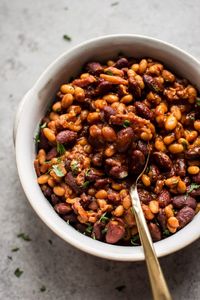 This easy baked beans with bacon recipe is sweet, smoky, and delicious with molasses, brown sugar, and liquid smoke. A definitely crowd pleaser!