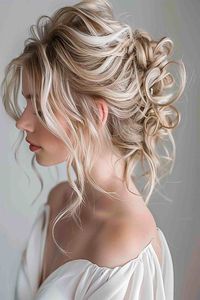 Save this pin to discover stunning wedding hairstyles for medium-length hair! Want a soft and enchanting look? Tap to see how a romantic tousled updo can give you a dreamy and elegant bridal style.