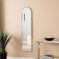 Liska Decorative Chrome Mirror A welcome reflection. Come home to minimalist shimmer with this full-length wall mirror. The arched silhouette and barely-there metallic frame add a touch of glam to the simple, sleek profile. Mount this functional mirror above your bench in the entry, or alongside your vanity desk in the bedroom dressing area for one last look before you dash out the door.