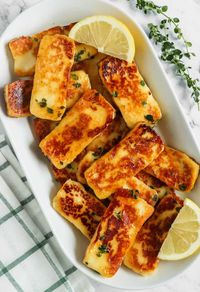 This fried Honey Glazed Halloumi recipe includes the combination of adding honey, lemon juice and thyme which is a flavour bomb with every bite! #cheese #sidedish #appetizer