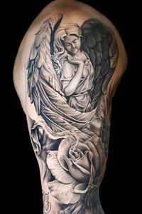 Black and grey realism angel with a rose