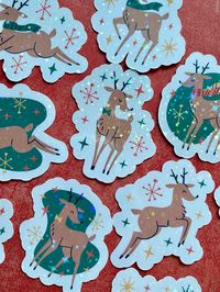 This listing is for a pack of 10 waterproof vinyl vintage reindeer stickers.  Stickers are made from white matte waterproof vinyl sticker paper and further protected with star patterned holographic laminate. Stickers measure 2-2.4 inches in width and 2-2.14 inches in height. All items are made in a smoke-free, pet friendly home. If items are damaged during shipping, please contact me ASAP and a like item will be offered as replacement.  Shipping times may vary depending on demand.  All items are