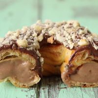 A light and fluffy choux pastry stuffed with Nutella cream, glazed, and then sprinkles with crushed hazelnuts!