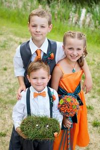 Flower girl in orange. Gray suspenders and bow tie for ring bearer and gray vest for my oldest. Orange and Blue wedding. Golf course wedding. Ring bearer with rings on golf tees. Www.taramurrayphotography.com: