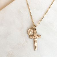 "Catholic jewelry is a meaningfuld gift! This heirloom quality Crucifix and Miraculous Medal are suspended from an 18\" rope chain. Crucifix is 7/8\" tall, paired with a dainty 3/8\" Miraculous Medal. Both medals are made in the USA and come with a lifetime guarantee."