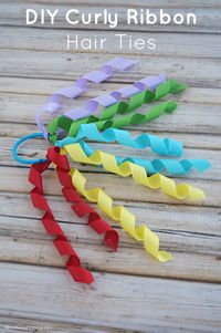 DIY Curly Ribbon Hair Ties are easy-to-make girls hair accessories. Craft Tip: Use Faultless Premium spray starch to help ribbons keep their curl.