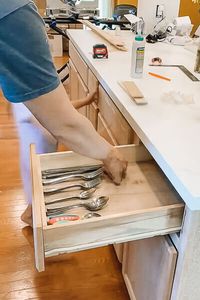 Discover the secret to maximizing the use of a small space in your kitchen with this easy DIY silverware drawer organizer! Follow my step-by-step guide and get ready to declutter and organize your cutlery like never before. Perfect for a fun, craft project on a budget.