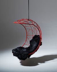 This hanging chair is inspired by the pods and vibrant red seeds of the Lucky Bean or Coral tree, a species of deciduous tree native to South Africa. The pattern detail on the chair resembles textures found in nature including a bird’s nest, intersecting branches of a tree, intertwining grasses, the veins in dragonfly wings, and veins in leaves.