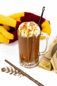 Apparate to Hogsmeade with a mug of Harry Potter Boozy Butterbeer. Warm and inviting, this butterscotch and vanilla cocktail is just magical.