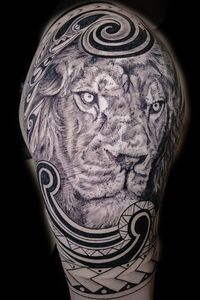 Polynesian style blackwork with black and grey lion done in realism