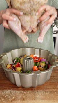 This easy Bundt pan roasted Greek chicken and vegetables gives incredible flavor to the potatoes, peppers, and carrots roasting below the whole, Greek-seasoned chicken, a whole new use for a Bundt pan. Add the fresh dill at the very end to maximize the bright herb's flavor.