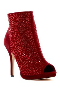 A rich scattering of rhinestones fans out across the vamp of a peep-toe bootie featuring a slim demure heel--the perfect finish to your night-on-the-town look.