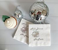 "Our gorgeous iridescent foiled disco ball cocktail napkins printed with \"All Disco No Panic' are perfect for your disco-themed event. These are perfect for a bachelorette, birthday party or New Year's Eve. Each pack contains 16 white paper cocktail napkins measuring  4.75 inches square when folded. Each stamped with a silver glitter foil with iridescent sparkles. These are an EnFete original design - you will only find them in our shop! Subscribe for updates, party tips, and free printables at: https://pages.convertkit.com/ceba5cd529/b18dafea38"