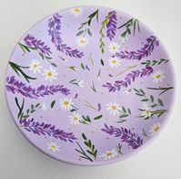 Circular ceramic trinket dish. Hand painted in purple and featuring daisies, wisteria, greenery and small gold polka dots. Finished with a gloss varnish.  Signed and dated with the year on the bottom. Please note that each dish is hand painted to order so there may be very small differences to the picture shown.  If you have any questions then please don't hesitate to ask!