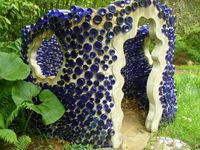 Garden Shed with Blue Glass Bottles