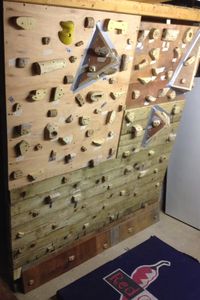 My homemade bouldering wall in my garage with wooden climbing holds that I made myself