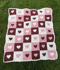 This beautiful heart blanket is made with 100% acrylic yarn in various shades of red, pink, and cream. Acrylic is soft, and durable for people of all ages.  This blanket is a throw size and measures about 5 ft by 5 1/2 ft, it is made up of multiple granny squares with a frill edge for a cute vibe <3  This is truly one of my favorite pieces I have ever made and I would love to send it to a good home so it can be properly enjoyed by the perfect person!