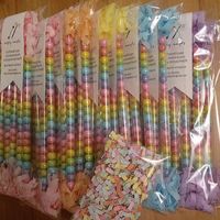 Lots of pastel rainbow love being lovingly packaged up tonight! (Pastel rainbow candy wands with mixed tissue fringe: $1.50 each. Order via email in profile.) #handcraftedparties #candywands #rainbowparty #unicornparty #partyfavor #sixlets