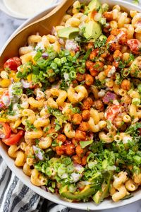 This Buffalo Chickpea Pasta Salad is the ultimate vegan salad! Made with crispy buffalo chickpeas, dairy-free green chile ranch, pasta & veggies!