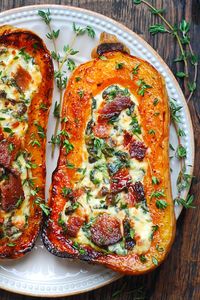 stuffed butternut squash with spinach, bacon, and cheese on a plate