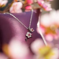 Enchanted Disney Mulan Live Action Rhodolite and 1/10 CT. T.W. Diamond Flower Pendant in Sterling Silver - 19"