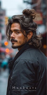 Introducing the "Hun Man Bun" – a hairstyle that effortlessly blends the best of both worlds. Picture this: the back is left flowing, capturing a laid-back vibe. But wait, there's more! Some gents are taking it up a notch by double-bunning, knotting the back section for that extra cool factor.