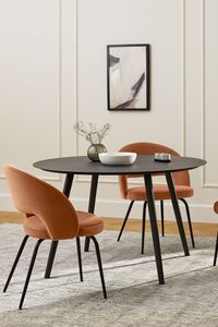 The Kapp dining chair exudes playful mid-century style with thoughtful updates: apartment inspiration, my dream home, apartment inspo, dining nook, dining area, black round dining table, mid century dining room, upholstered dining chairs, vibey apartment, small apartment design