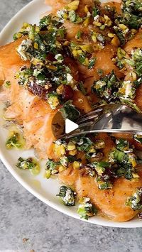 Caitlin Latessa-Greene on Instagram: "SLOW ROASTED SPICED HONEY SALMON WITH HERBED PISTACHIO-GOAT CHEESE-DATE CRUMBLE! Once you slow-roast your salmon, you may never go back!
•
For the salmon:
1 lb salmon filet
1 1/2 tbsp honey
1 tsp olive oil
1 tsp cumin
1 tsp paprika
1/2 tsp salt
1/2 tsp garlic powder
1-2 tbsp butter
Lemon slices
Lime slices
•
For the crumble:
1/3 cup pistachios 
1 oz goat cheese
2 tbsp chopped scallions
2 tbsp chopped cilantro 
2 tbsp chopped basil
Heavy pinch salt
Zest of 1/2 lemon
3-4 dates
1/2 tbsp olive oil, plus extra for drizzle
•
1️⃣Preheat the oven to 275. Line a sheet pan with parchment paper. 2️⃣Make the honey mixture. Add the honey, olive oil, cumin, paprika, salt and garlic powder to a small bowl and mix to create a thick spread. 3️⃣Place the lemon and lime 