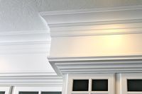 3 pieces of trim - crown, a baseboard hung upside down, and pin mold at the bottom of the soffit.