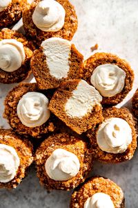 Pumpkin muffins are getting a lightly crunchy, sparkly cinnamon sugar topping, and then stuffed to the brim with maple cream cheese whipped cream. YUM.