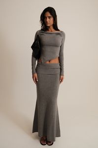 Winter bliss.Elevate your wardrobe with the KARLIE Knit Maxi Skirt, a timeless piece designed for both elegance and comfort. Featuring a mid-rise waist and a sleek hip overlay, this skirt effortlessly flatters your silhouette. The maxi length and fishtail hem add a touch of sophistication, making it perfect for any occasion. Crafted from a soft, unlined knit, the Karlie Knit Maxi Skirt ensures a comfortable fit while maintaining a chic and polished look. For a complete ensemble, pair it with the