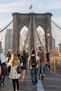 People walking on the Brooklyn Bridge