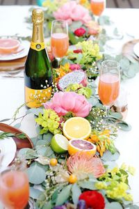 Citrus-Inspired - The Prettiest Spring Wedding Tablescapes From Pinterest - Southernliving. A bright and fresh way to use up citrus fruit at your wedding ceremony. This garland is pretty enough to eat and features lemons, limes, grapefruits, and oranges.