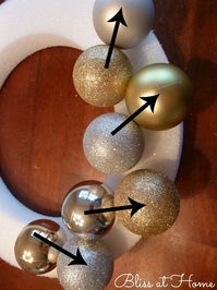 the perfect ornament wreath a tutorial, crafts, seasonal holiday d cor, wreaths, Step 1 Start with your large ornaments and attach them 2 at a time on the top of the wreath It is best to put them at an angle Note I also used the duller ornaments first